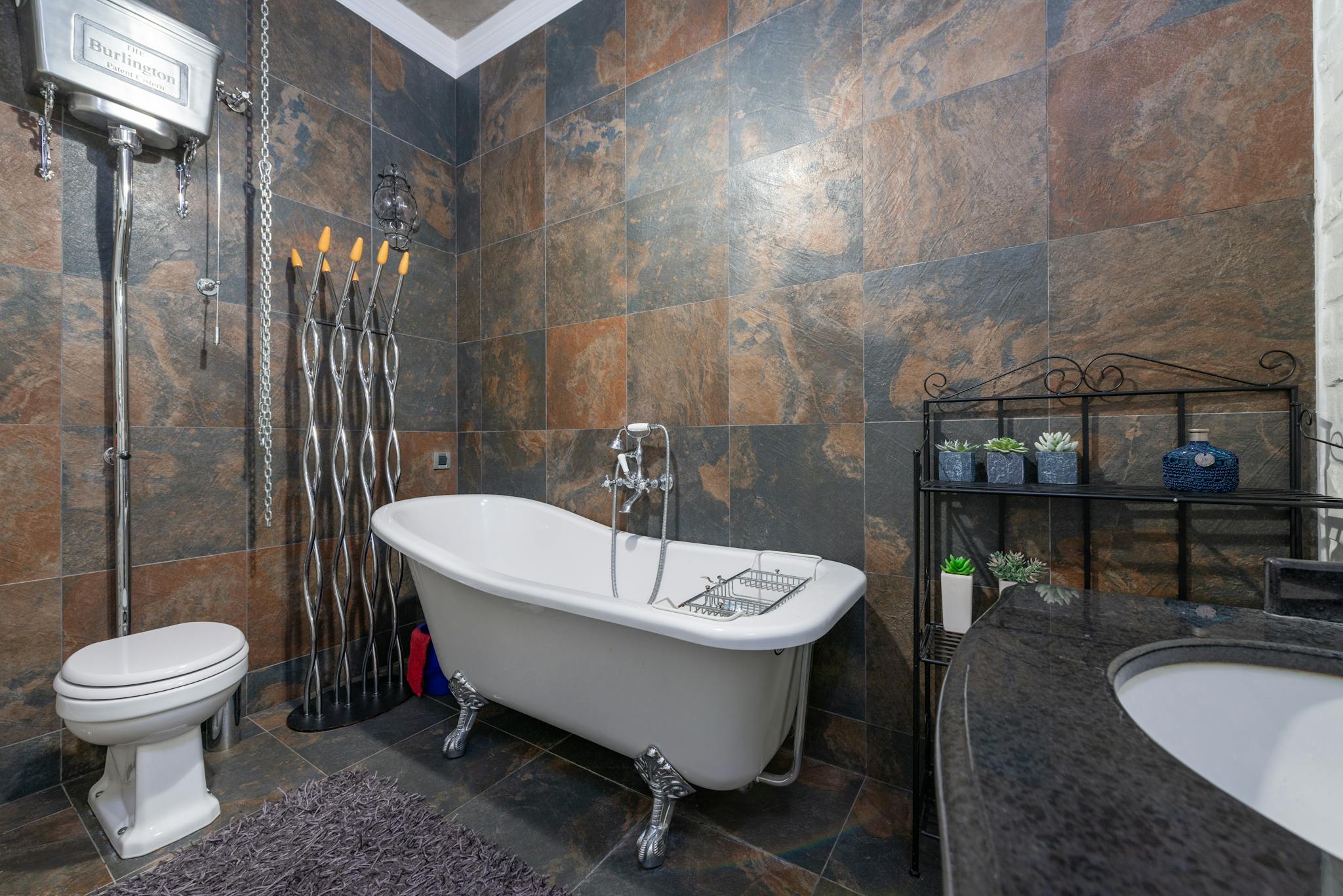 Luxurious bathroom featuring a classic clawfoot bathtub and modern decor.